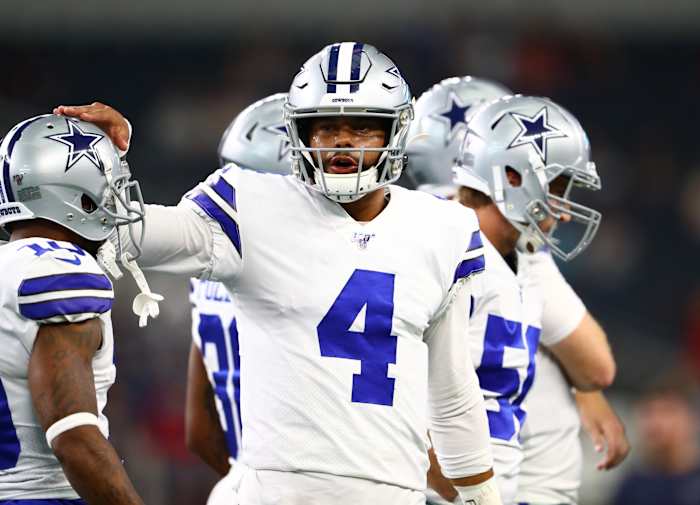 Aug 24, 2019; Arlington, TX, USA; Dallas Cowboys quarterback Dak Prescott (4) pats the helmet of receiver Tavon Austin (10) prior to the game against the Houston Texans at AT&T Stadium.